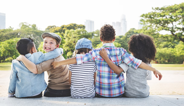 kids sitting hugging